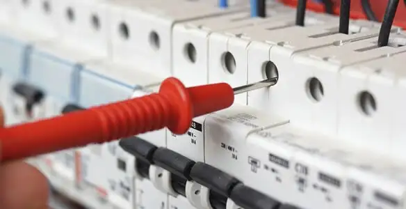 Electrical contractor testing circuit breakers during electrical repair in Bradenton Beach, FL