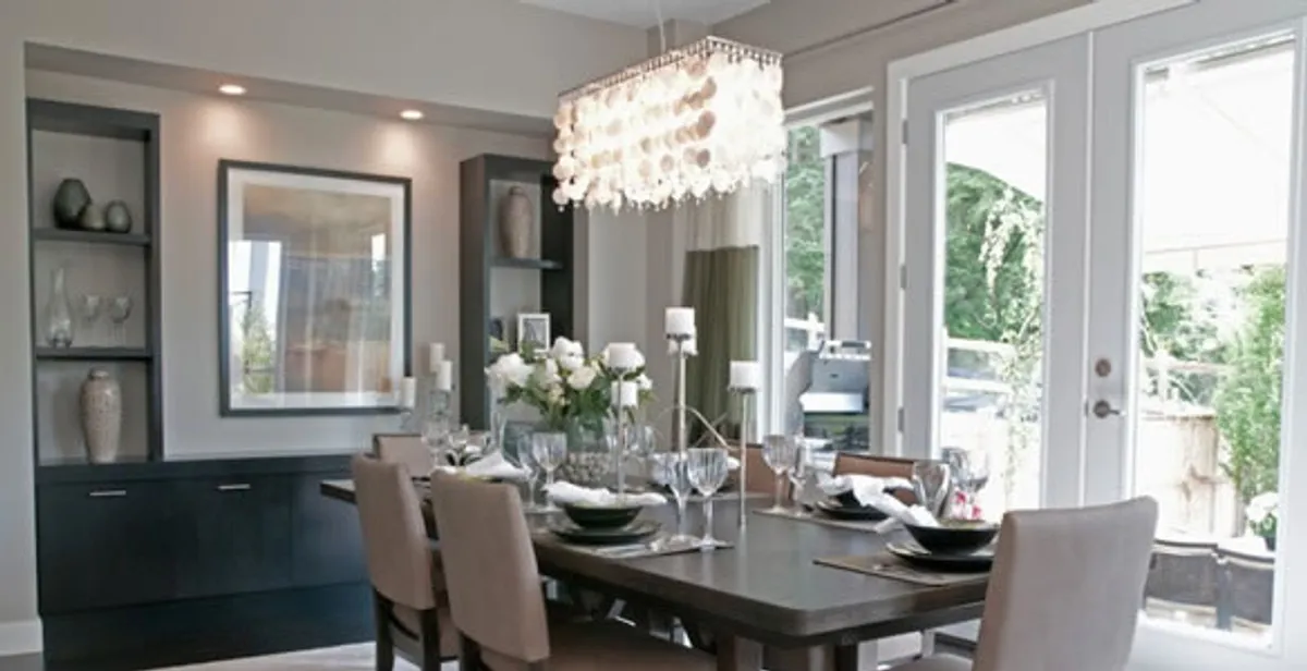 Elegant dining room chandelier installation above table in Bradenton, FL
