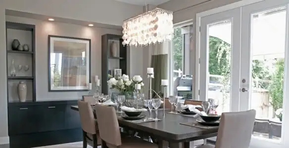 Elegant dining room chandelier installation above table in Bradenton, FL