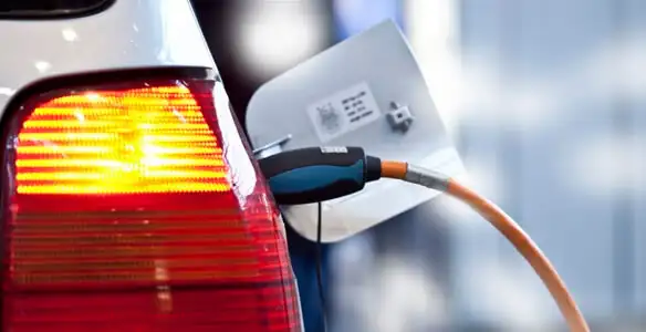 Electric car plugged into EV charger after professional installation in Bradenton, FL