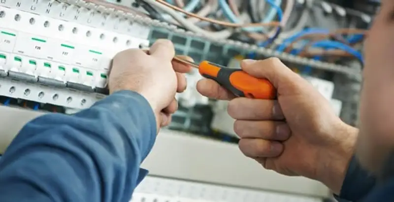 electrical service showing licensed electrician performing electrical panel maintenance and adjustments in Bradenton, FL