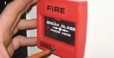 fire alarm installation service showing manual fire alarm pull station installed by licensed electricians in Bradenton, FL