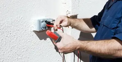 Electrician performing home electrical outlet and wiring inspection in Bradenton, FL