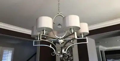 Modern chandelier installation with multiple light fixtures in Bradenton, FL