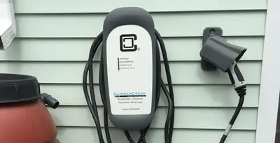 Outdoor electric vehicle charger installation on residential wall in Bradenton, FL