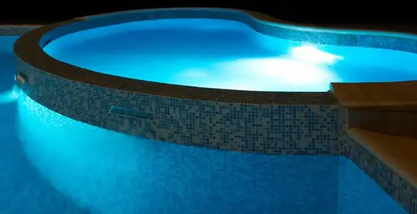 pool light installation and repair services highlighting illuminated pool interior lighting in Bradenton, FL